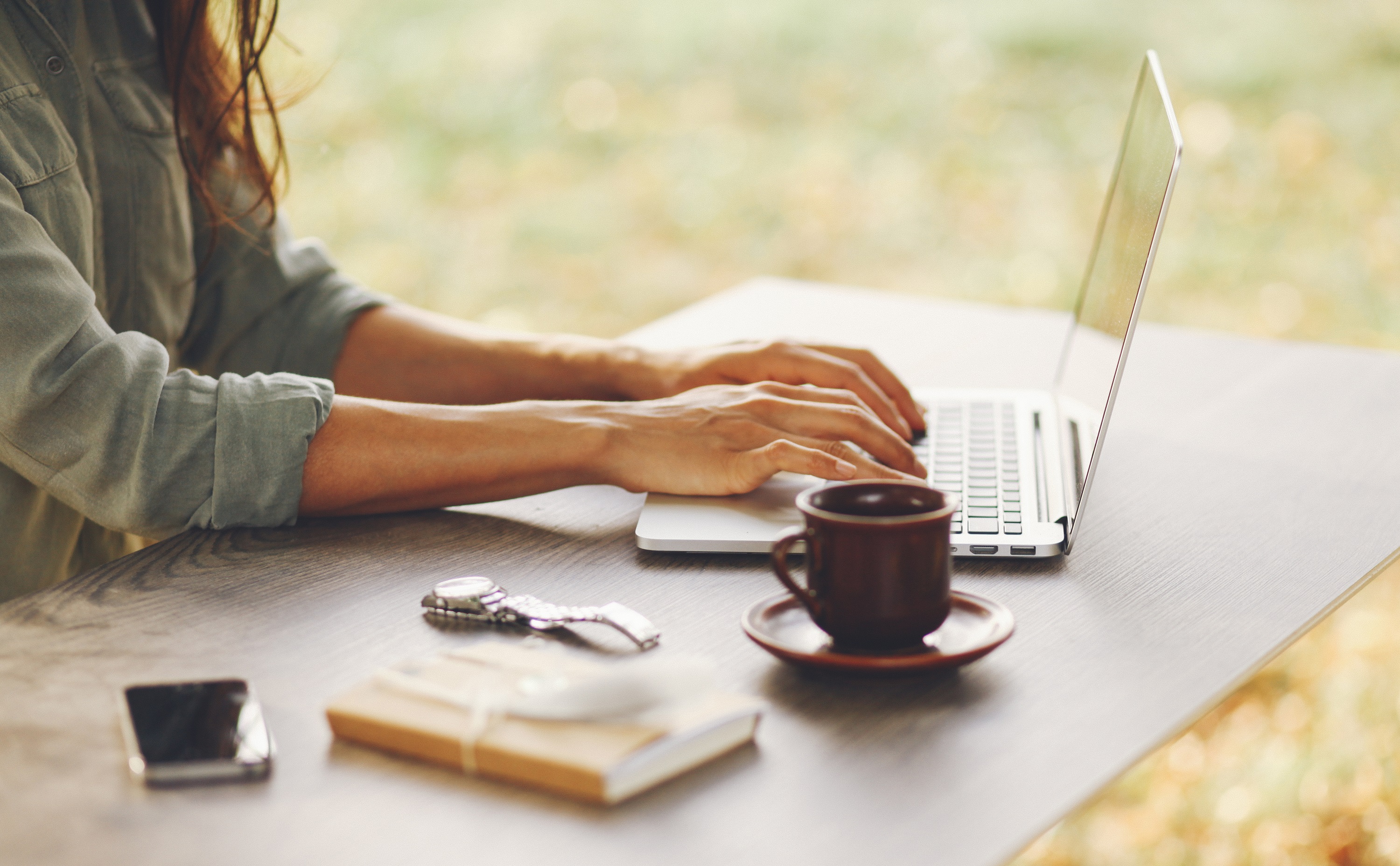 Female novelist writing on her laptop